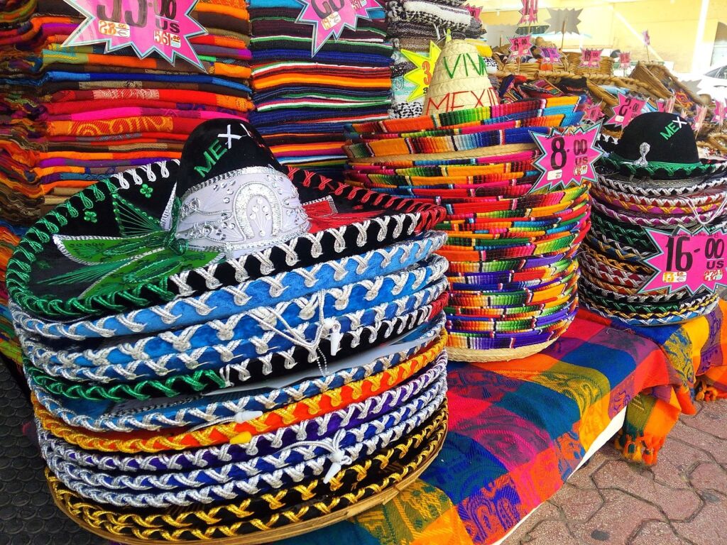 Piles of traditional colorful Mexican sombrero hats, souvenirs sold in Cancun, Playa del Carmen, Tulum and other popular Mexican tourist towns and resorts