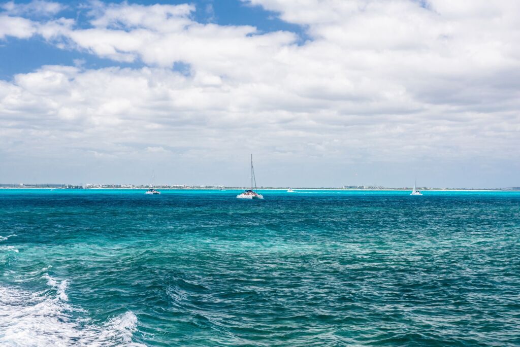 Sailboat and turquoise clear water, blue water, Caribbean ocean, Isla Mujeres, Cancun, Yucatan Mexico.