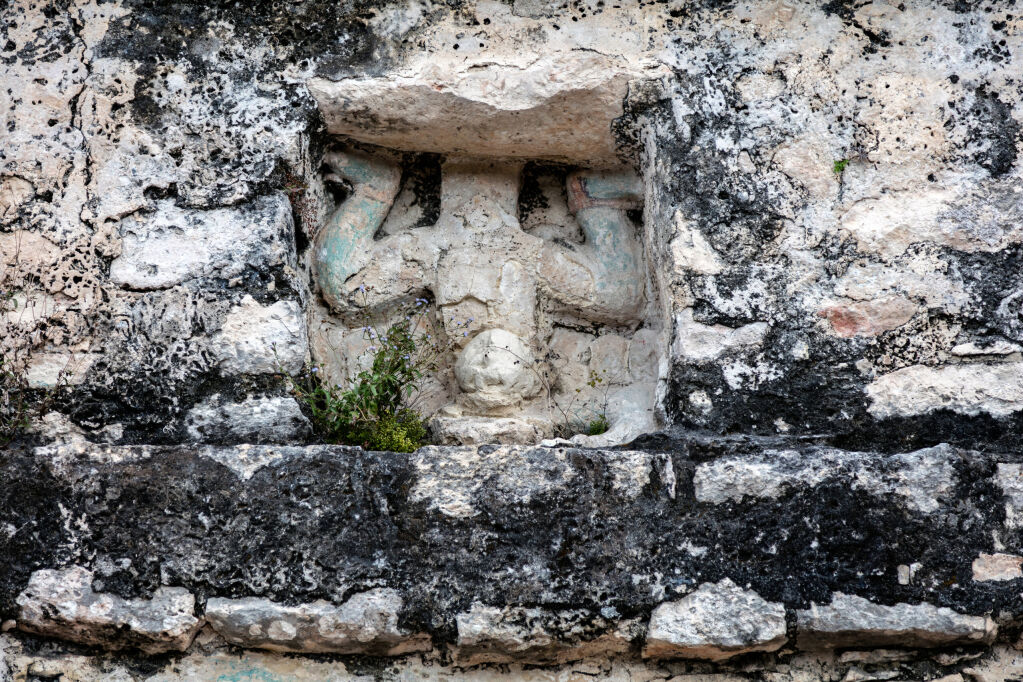 Ancient Mayan carving of the 'diving god' over the door of the small temple building which crowns the Coba pyramid in Quintana Roo, Yucatan, Mexico.