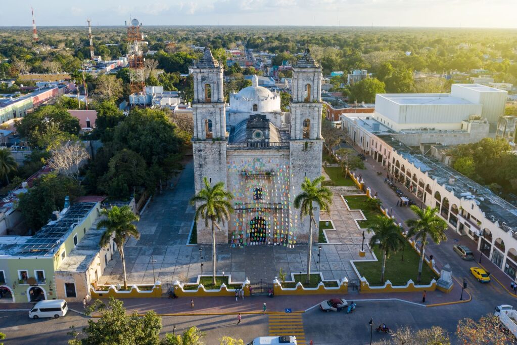 Iglesia De San Servacio Cathedral in Valladolid Mexico down town main city square. symmetrical aerial photo shot, camera zooms in on the cathedral between the towers. Valladolid Mexico 