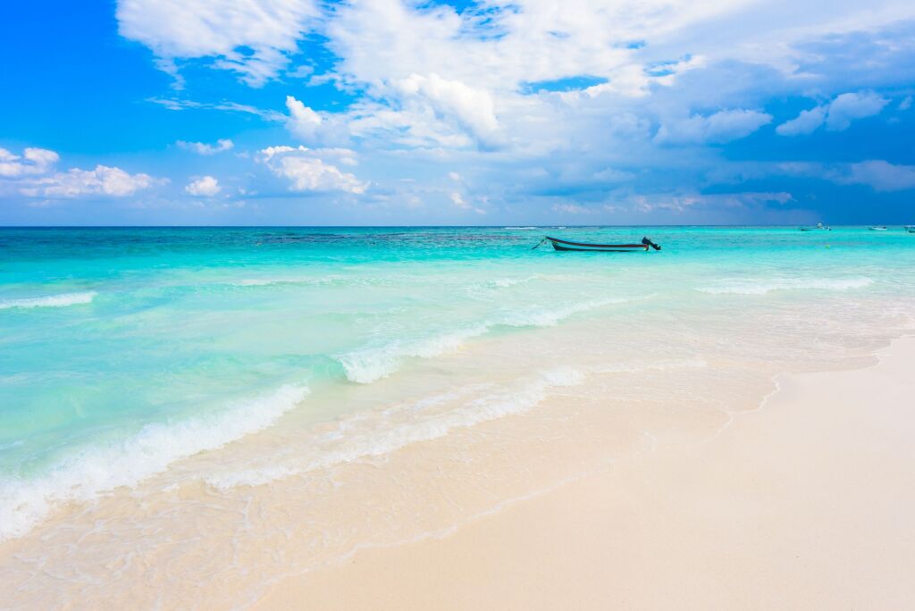 Xpu-Ha Beach - boat at beautiful caribbean coast of Mexico - close to Cancun and Tulum in Quintana Roo - Riviera Maya