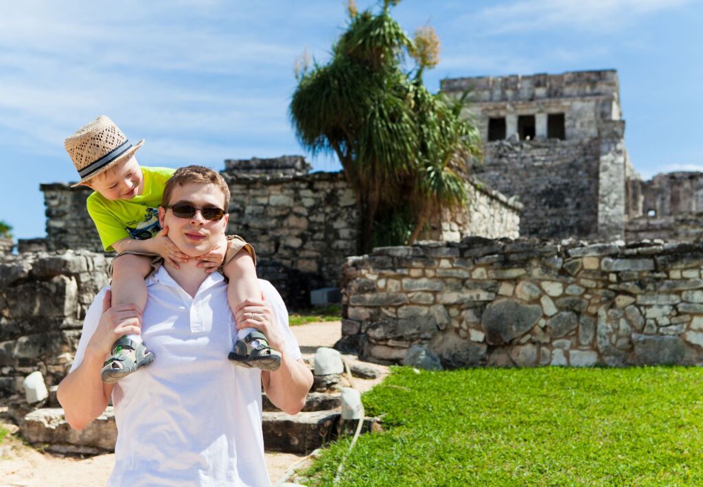 Young father with his son sightseeing in Tulum, Mexico