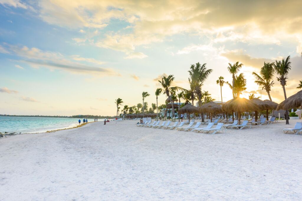 Beautiful white sand beach in Akumal, Mexico - paradise bay Beach in Quintana Roo - caribbean coast - sunset at Riviera Maya